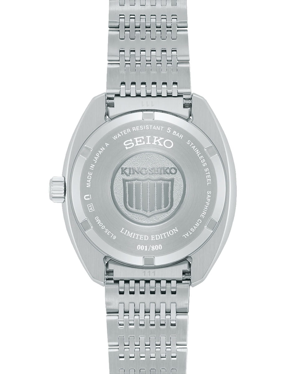 Back view of Seiko wristwatch with stainless steel case and bracelet.