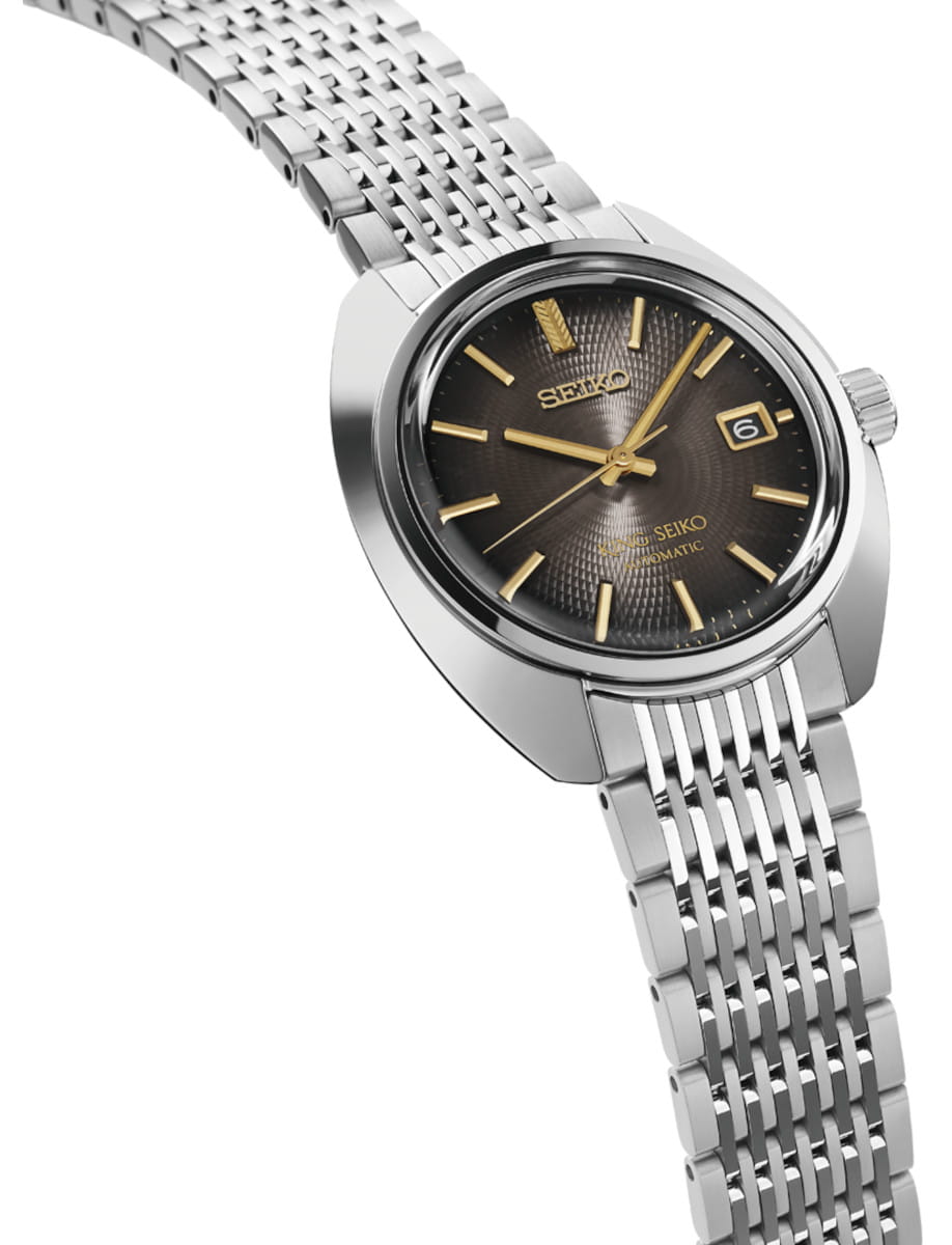 Side view of Seiko wristwatch with stainless steel case and bracelet.