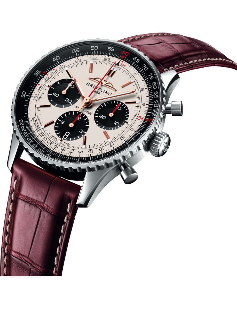 Side view of Breitling Navitimer B01 Chronograph 43 wristwatch with stainless steel case, silver dial with black subdials, and brown aligator leather.