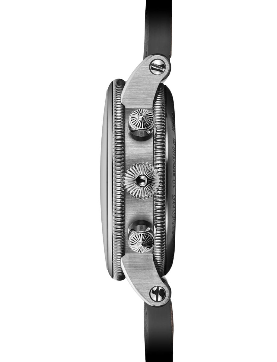 Side view of Chronoswiss Lunar Chronograph wristwatch with stainless steel case, Guilloché-decorated dial, and dark leather nubuck leather.