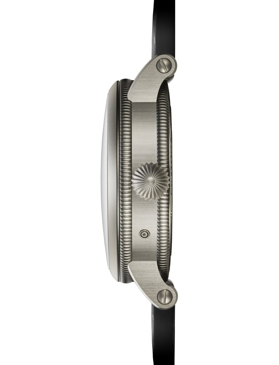 Side view of Chronoswiss wristwatch with stainless steel case, skeleton dial, and grey nubuck leather strap.