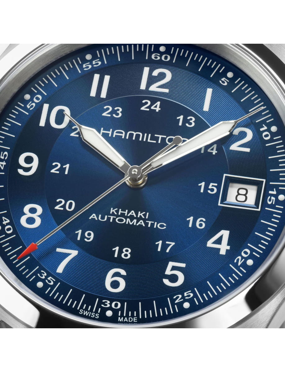 Close view of Hamilton Khaki Field wristwatch with stainless steel case, blue dial, and blue textile strap.