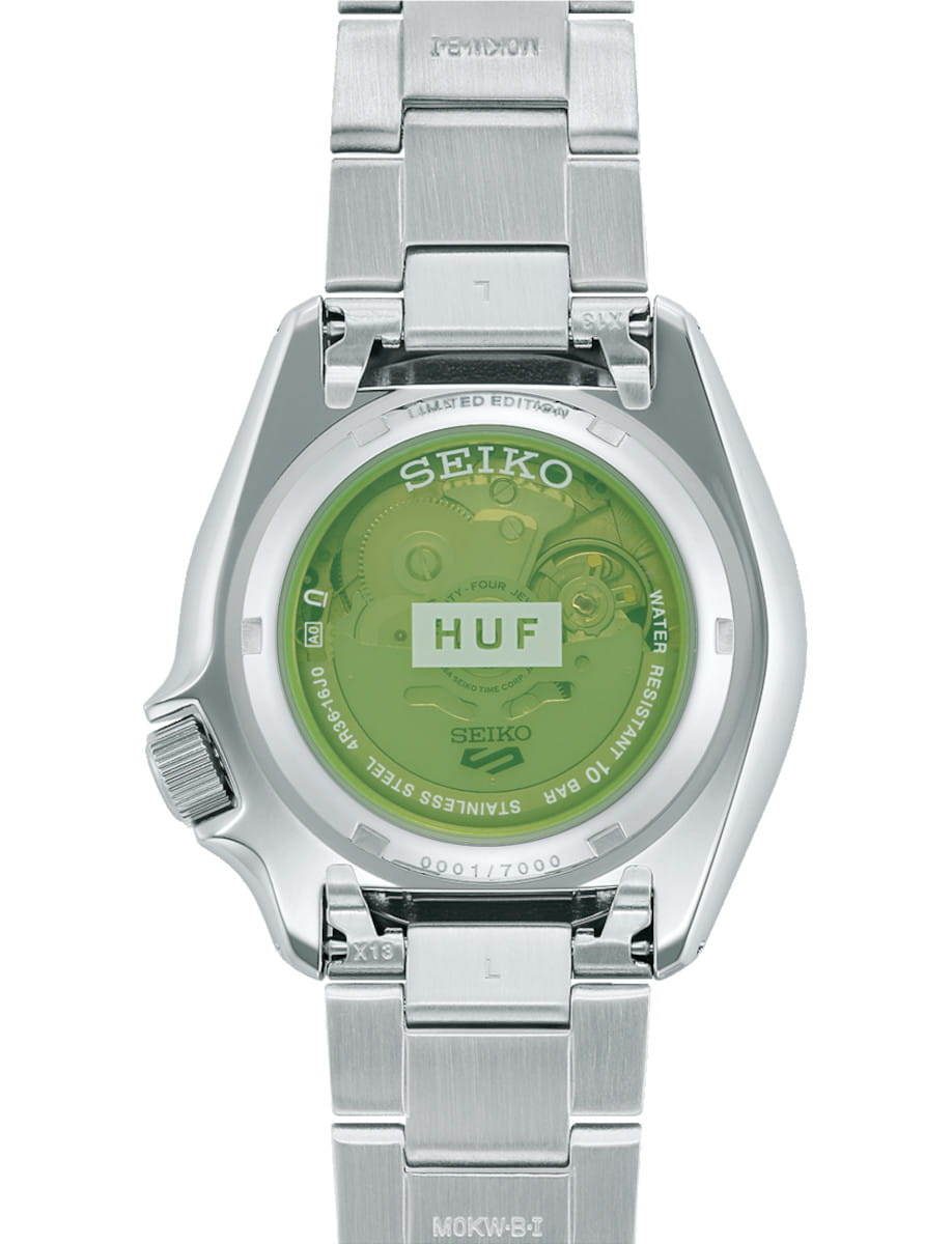 Back view of Seiko wristwatch with stainless steel case and bracelet, and exhibition case back.