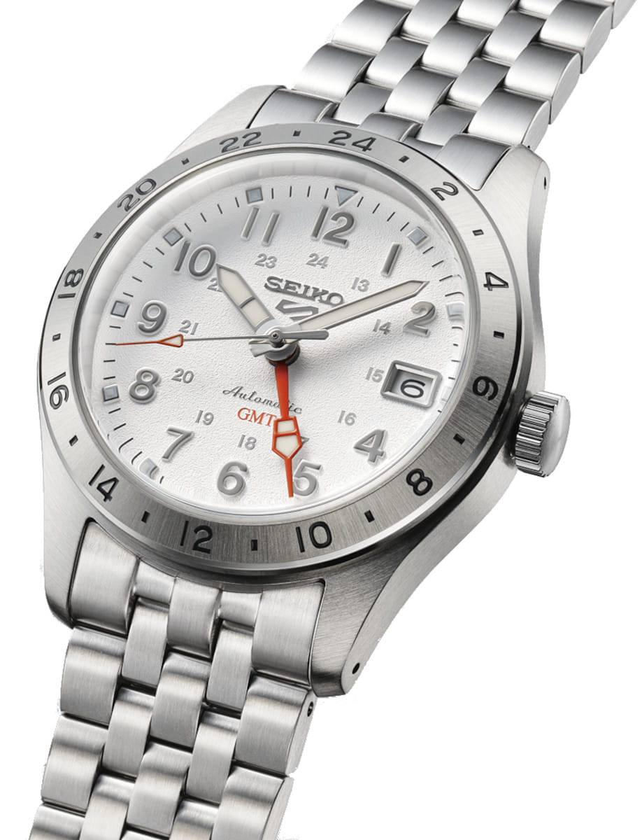 Side view of Seiko wristwatch with stainless steel case and bracelet, and white dial.