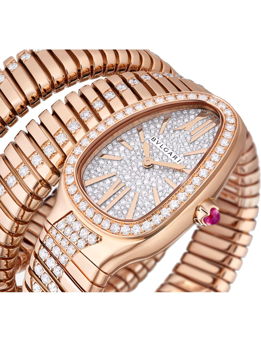Side view of Bulgari Serpenti Tubogas Infiniti wristwatch with 18k rose gold set with diamond and full pavé dial, and 18k rose gold bracelet.
