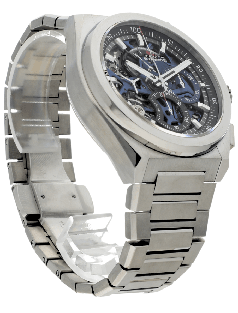 Front right side of pre-owned Zenith wristwatch with titanium case and bracelet, and blue dial.