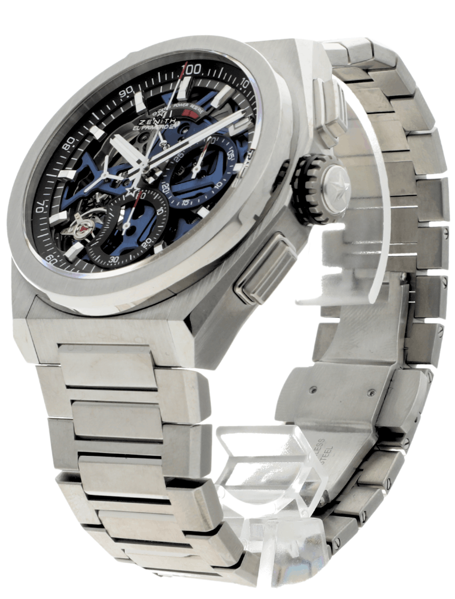 Front left side of pre-owned Zenith wristwatch with titanium case and bracelet, and blue dial.