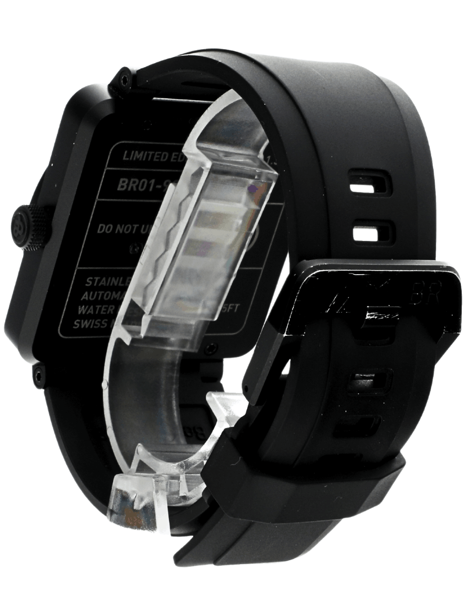 Back left side view of pre-owned Bell&Ross wristwatch with PVD coated stainless steel case, black dial, and black rubber strap.