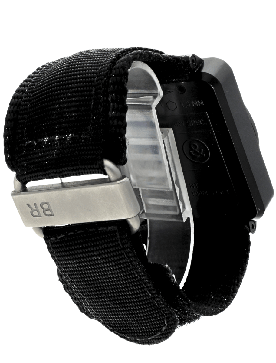 Back right side view of pre-owned Bell&Ross wristwatch with PVD coated stainless steel case, black dial, and black fabric strap.