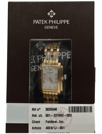 Pre-owned Patek Phillipe with yellow gold case and bracelet, and white dial.