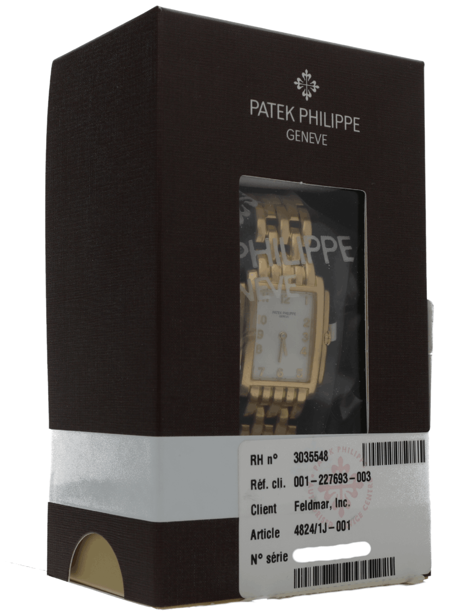 Side view of pre-owned Patek Phillipe with yellow gold case and bracelet, and white dial.