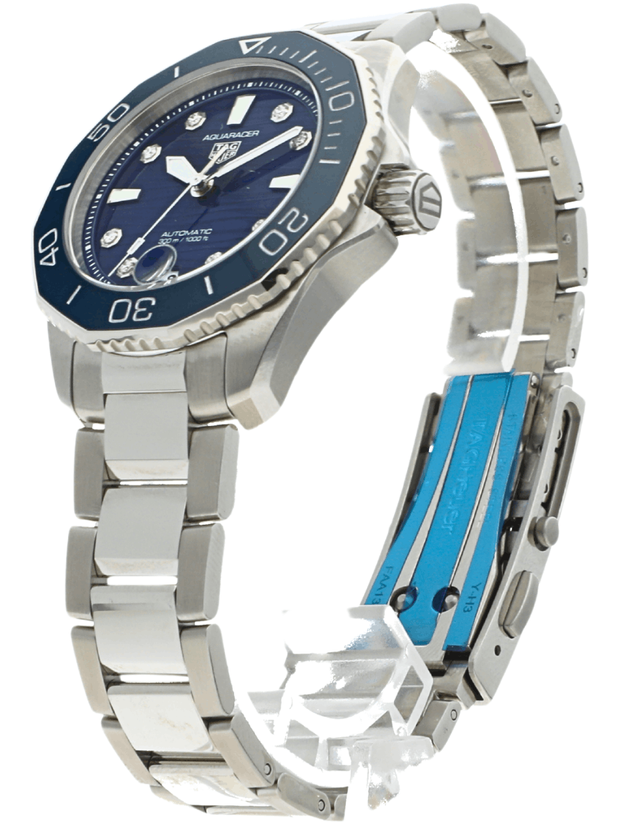 Front left side view of pre-owned Tag Heuer wristwatch with stainless steel case and bracelet, and blue dial.