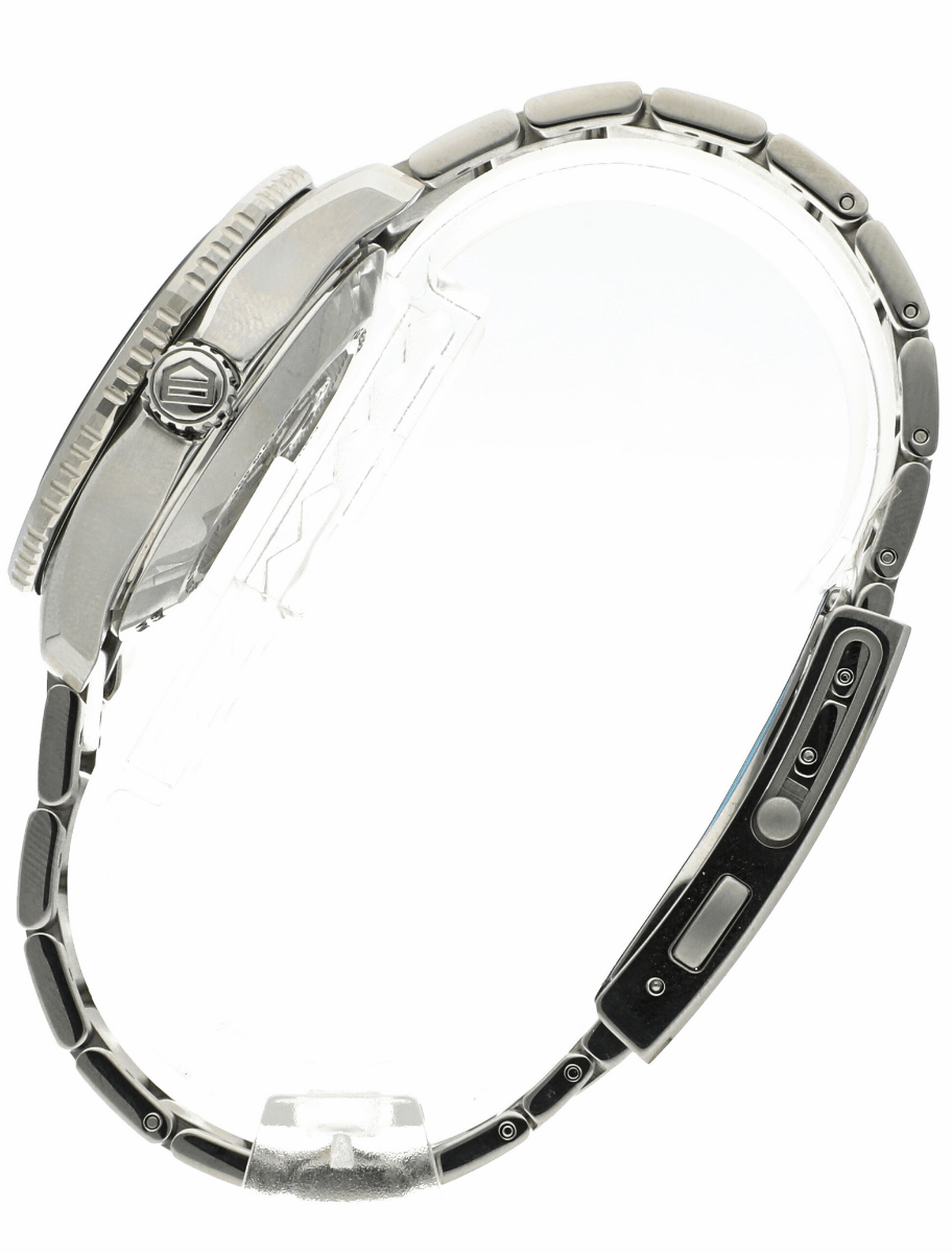Left side view of pre-owned Tag Heuer wristwatch with stainless steel case and bracelet, and blue dial.