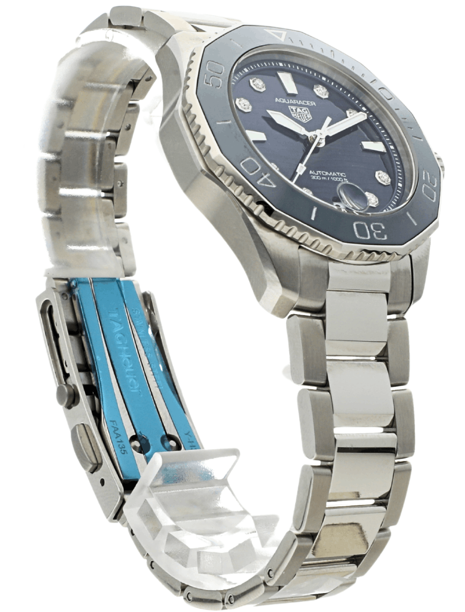 Front right side view of pre-owned Tag Heuer wristwatch with stainless steel case and bracelet, and blue dial.