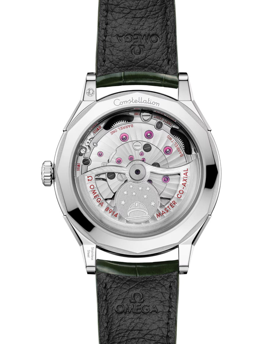 Side view of Omega Constellation Observatory wristwatch with O‑MEGASTEEL case, transparent case back, and green alligator leather.