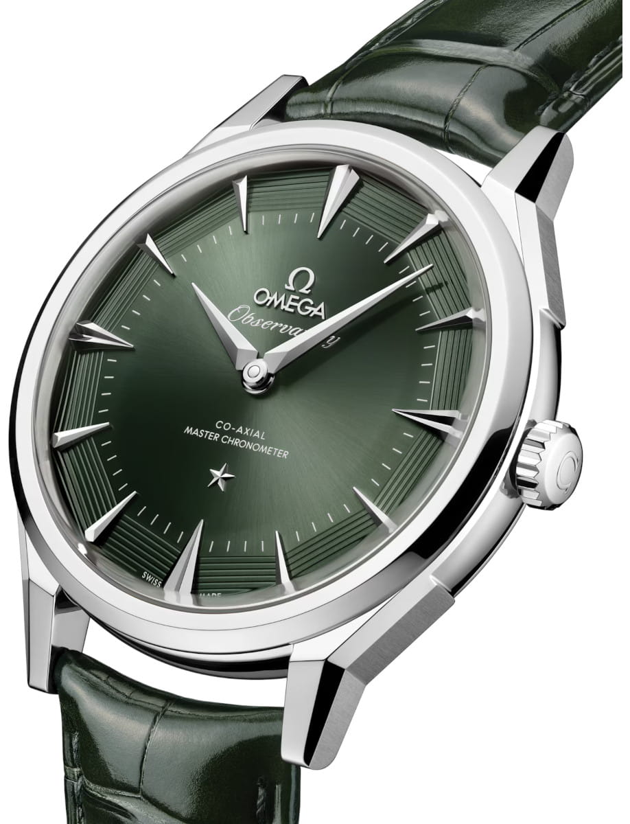 Side view of Omega Constellation Observatory wristwatch with O‑MEGASTEEL case, green dial, and green alligator leather.