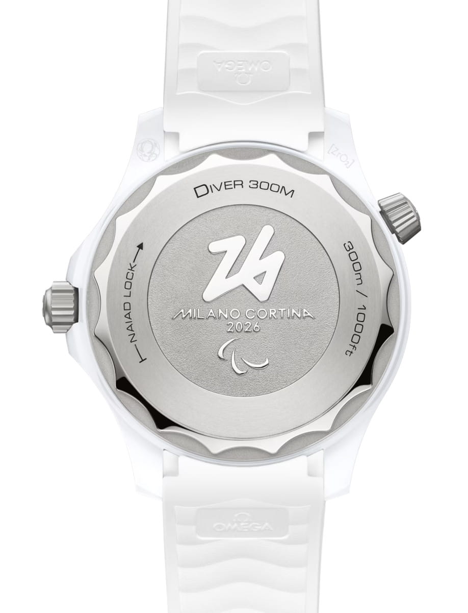 Back view of Omega wristwatch with white ceramic ‑ titanium case, solid case back, and white rubber strap.