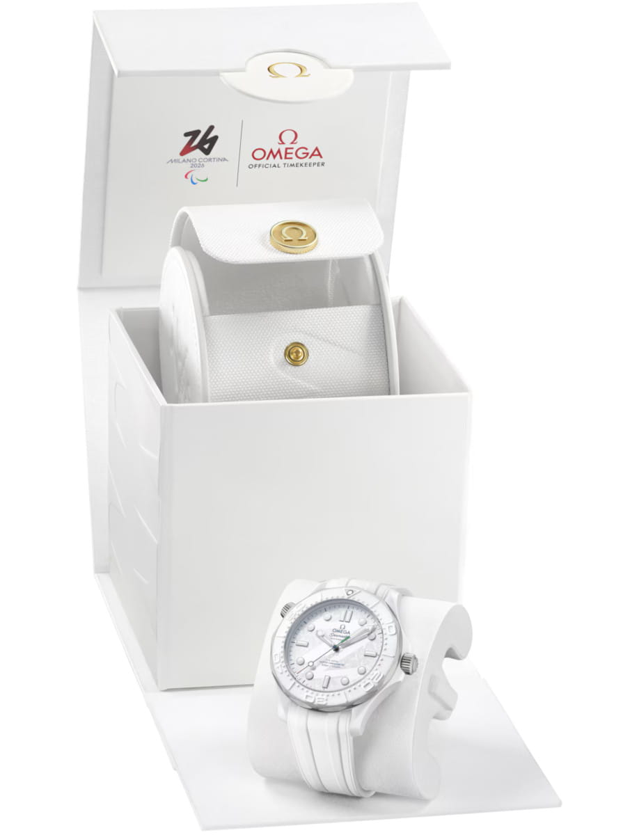 Box view of Omega wristwatch with white ceramic ‑ titanium case, and white dial.