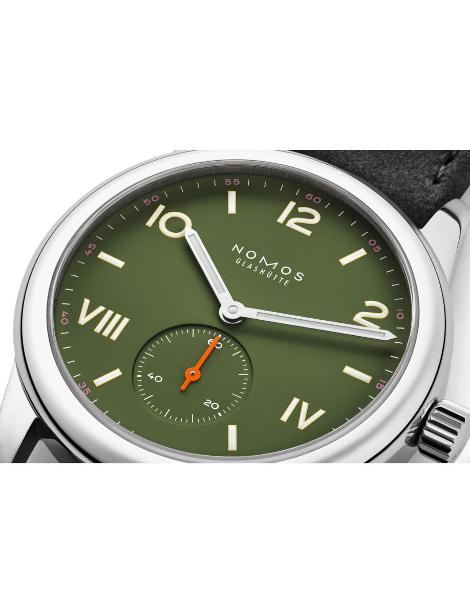 Front side view of Nomos Club Campus All Olive wristwatch with stainless steel case, olive green dial, Vegan velour remborde anthracite strap.