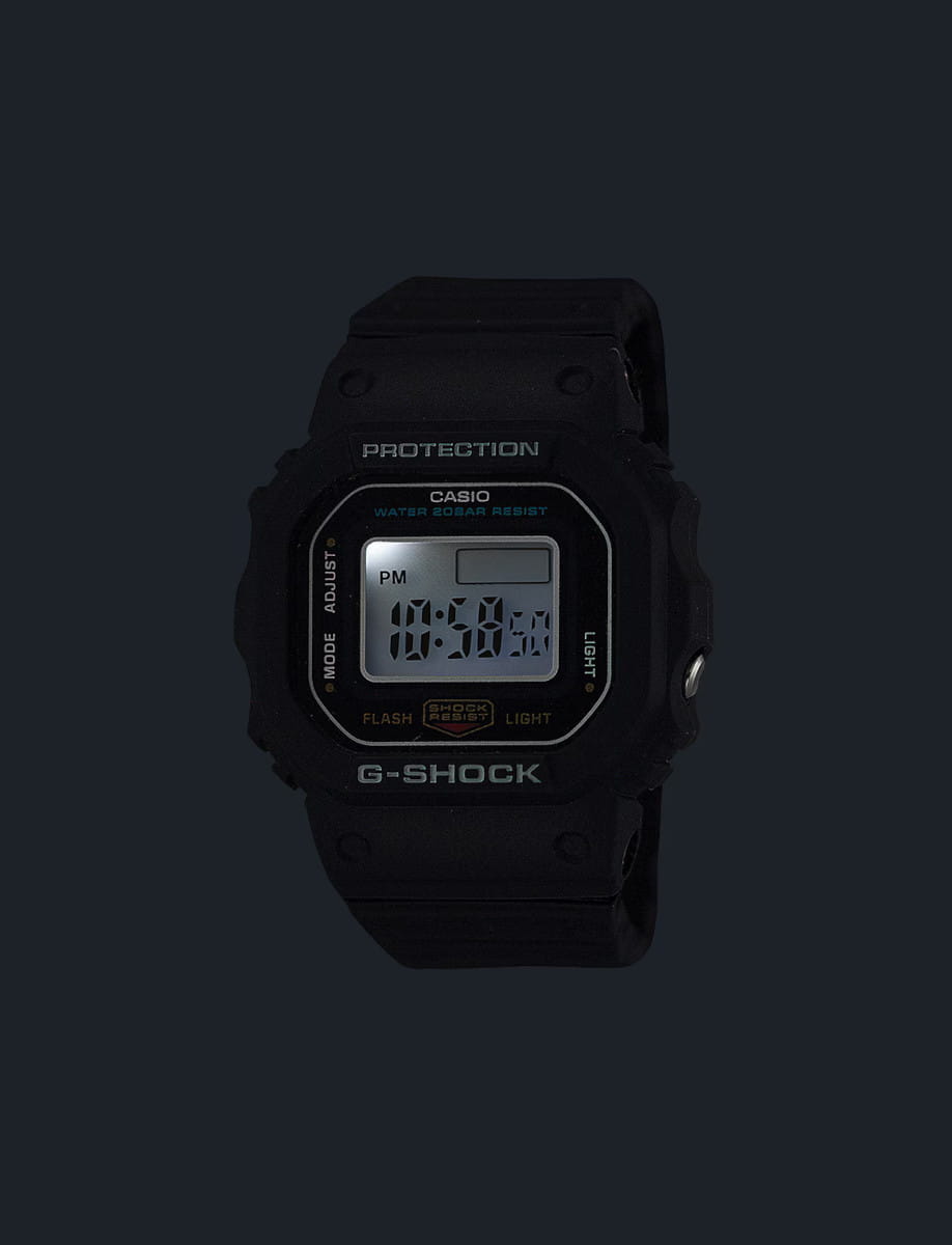 Night view of G-Shock wristwatch with resin and bio-based resin case and bracelet, and digital display.