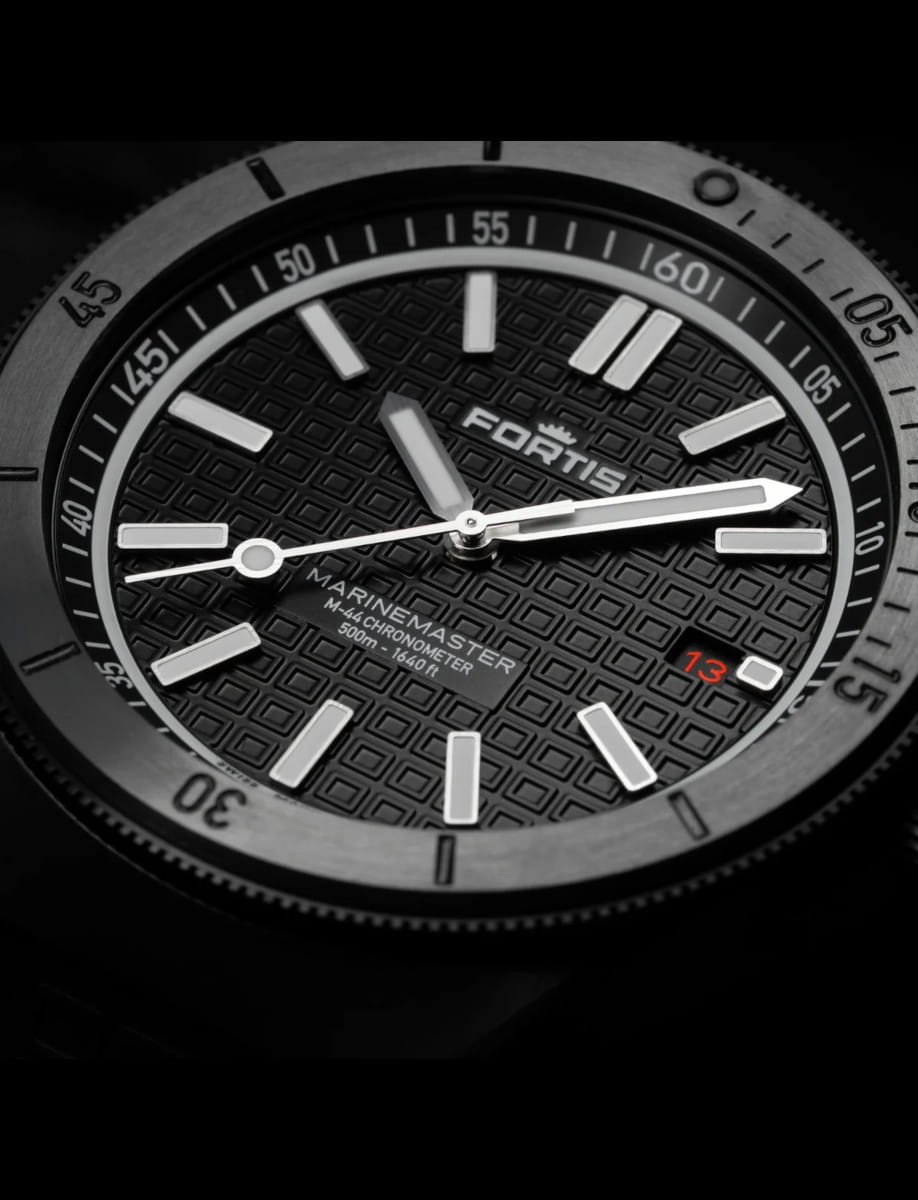 Close view of Fortis wristwatch with DLC Dianoir® and regular Stainless Steel case, Black dial with Fortis O-pattern with applied Superluminova®X1 Markers, and Hypoallergenic FKM rubber strap.