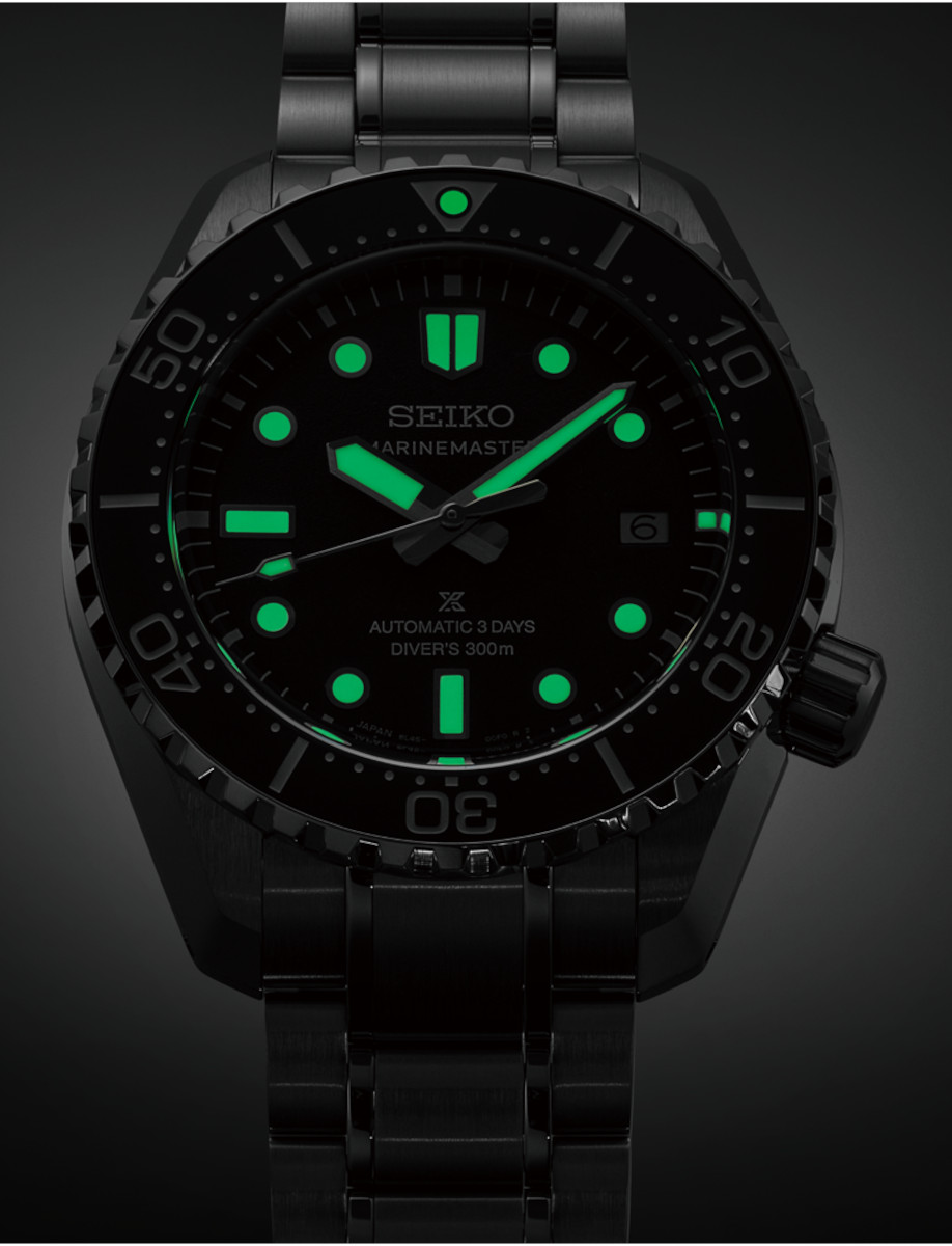 Night view of Seiko Prospex wristwatch with stainless steel case and bracelet, and black dial with luminous hands and hour markers.