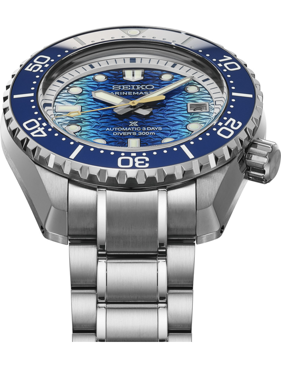 Side view of Seiko Prospex wristwatch with stainless steel case and bracelet, and blue dial.