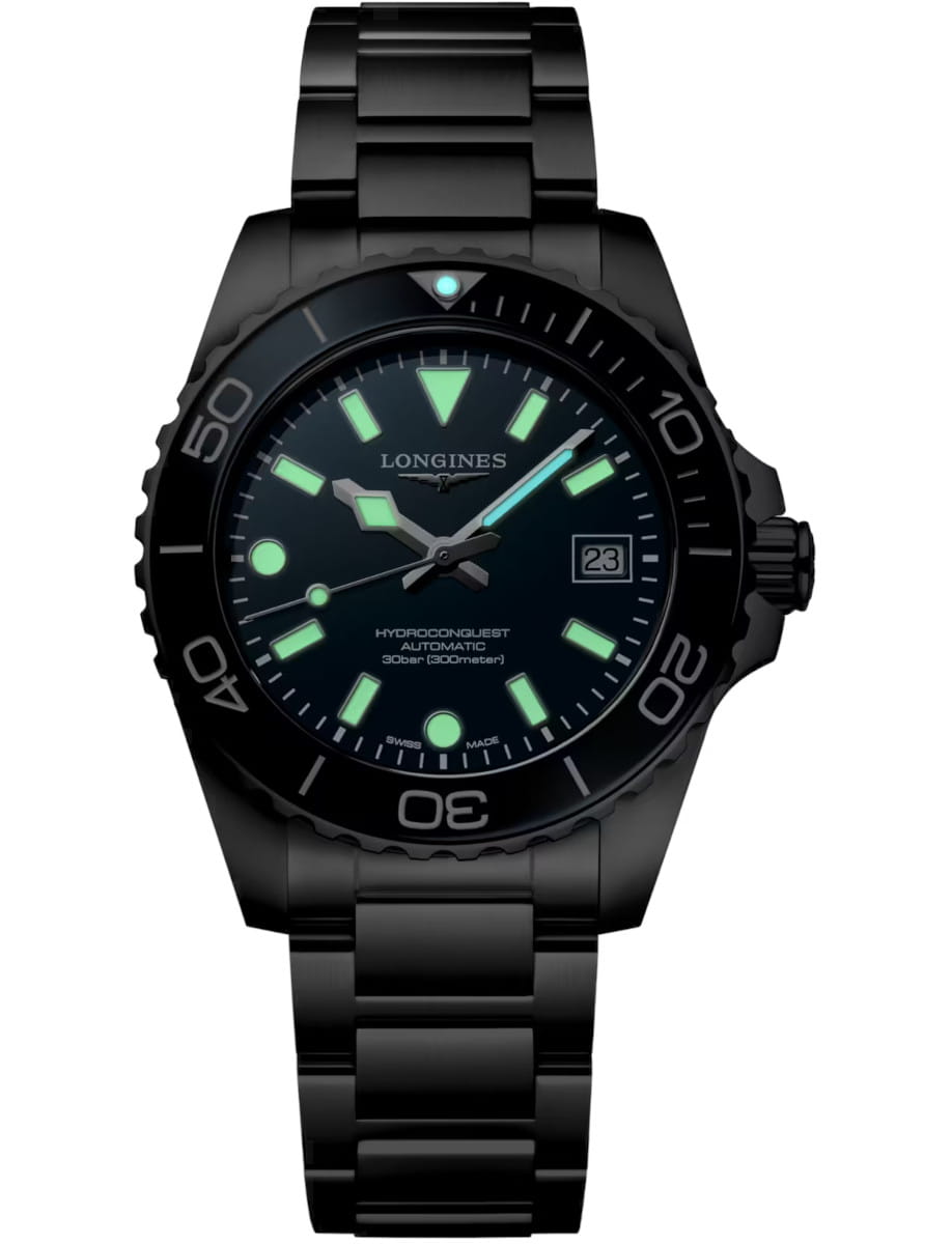 Night view of Longines Hydroconquest wristwatch with stainless steel case and bracelet, and blue dial with luminous hands and markers.