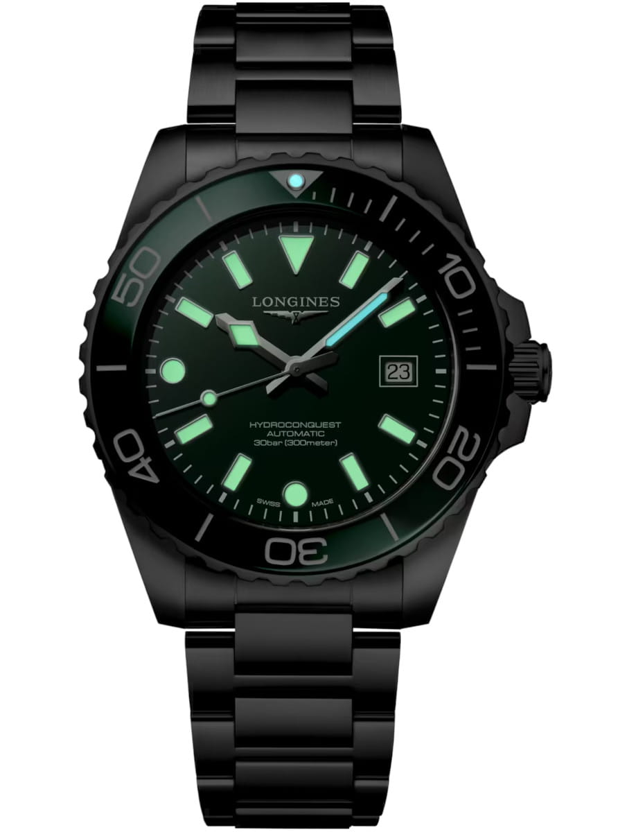Night view of Longines Hydroconquest wristwatch with stainless steel case and bracelet, and green dial.