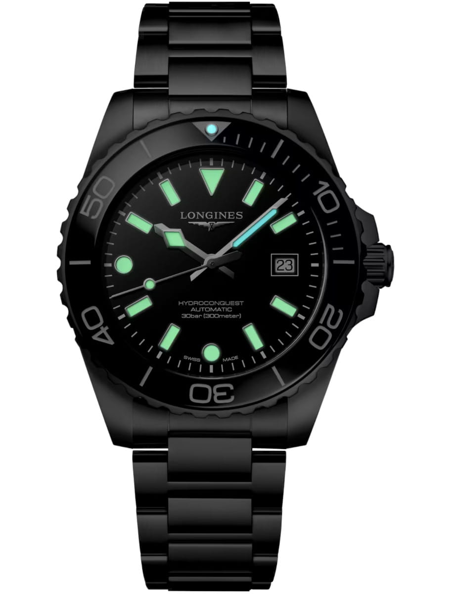 Night view of Longines Hydroconquest wristwatch with stainless steel case and bracelet, and black dial.