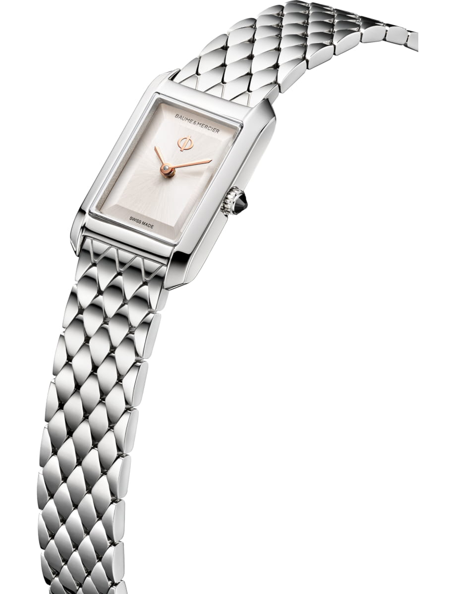 Side view of Baume & Mercier wristwatch with stainless steel case and bracelet and warm silver dial