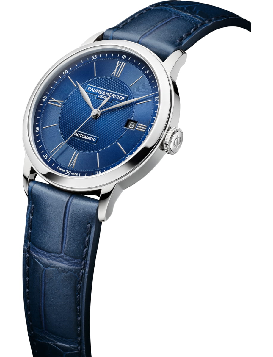 Side view of Baume & Mercier wristwatch with stainless steel case, blue dial and blue calfskin leather