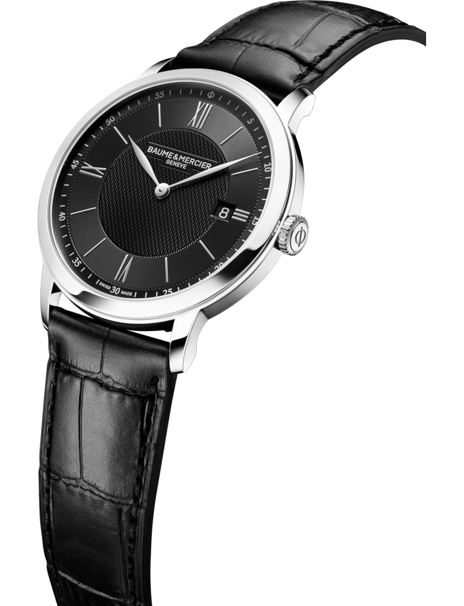 Side view of Baume & Mercier wristwatch with stainless steel case, black dial and black calfskin leather strap