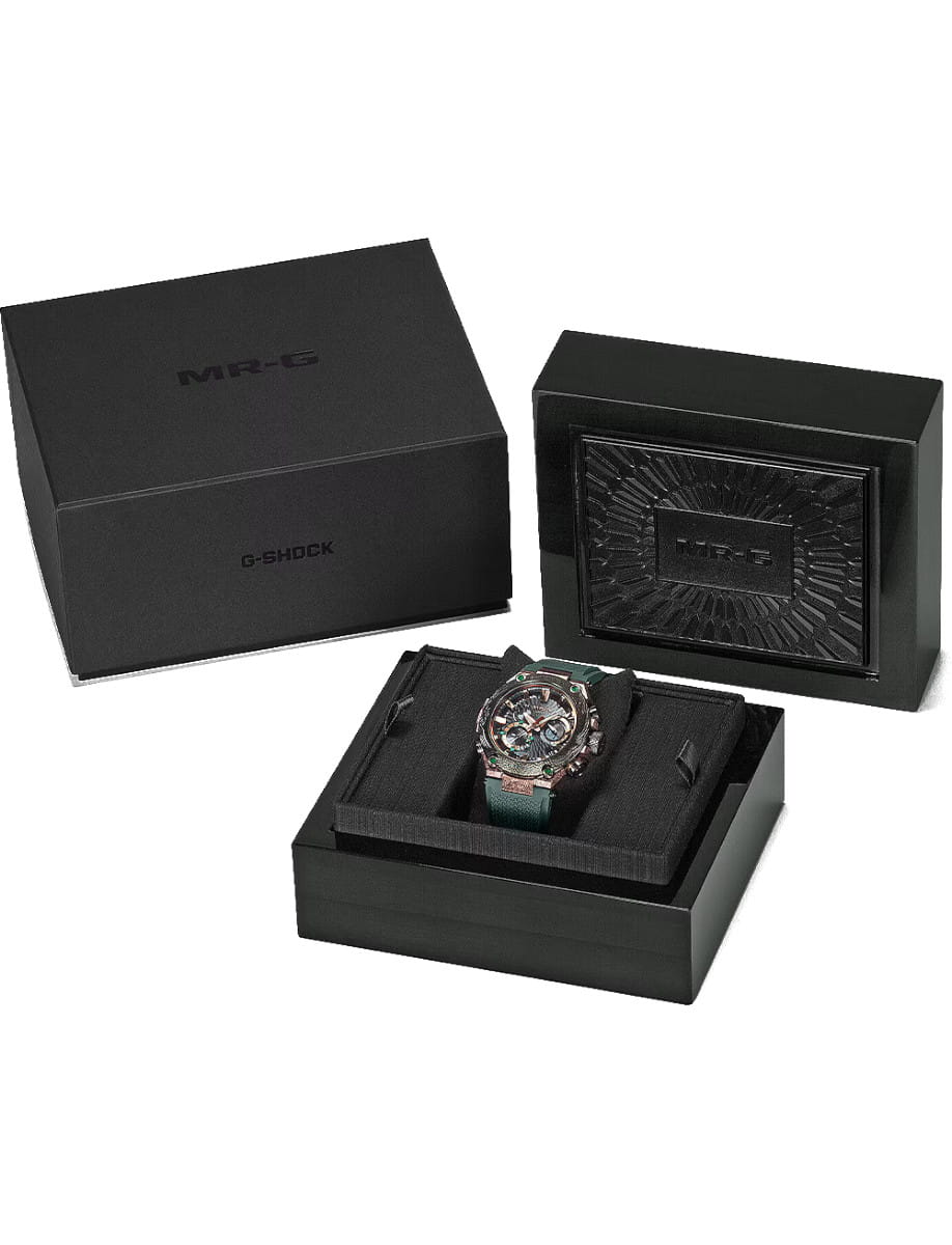 Box view of G-Shock wristwatch with titanium case, black dial, and dark green Dura Soft rubber strap.