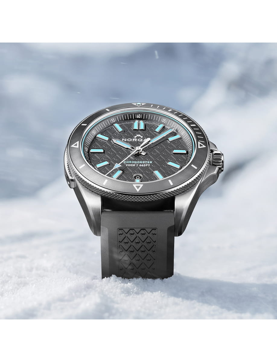 Front view of Norqain wristwatch with stainless steel case, grey dial and grey rubber strap