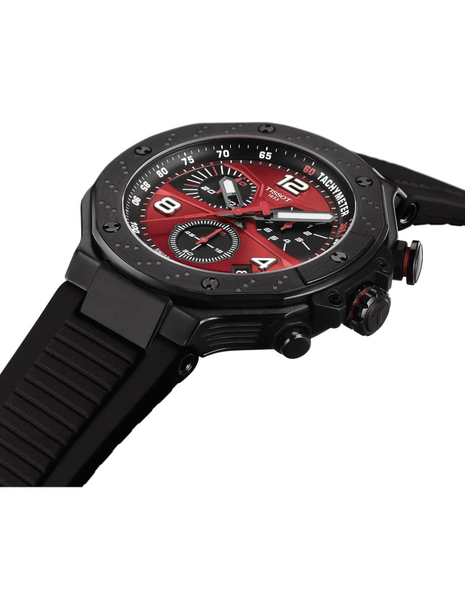 Side view of Tissot wristwatch with stainless steel case with black PVD coating, black rubber strap and red dial.