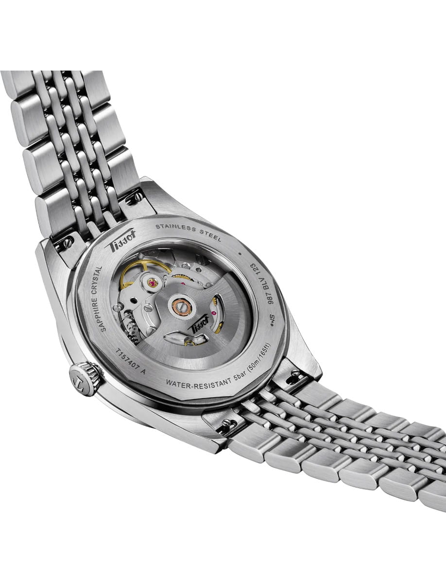 Back view of Tissot Visodate wristwatch with stainless steel case and bracelet, and blue dial.