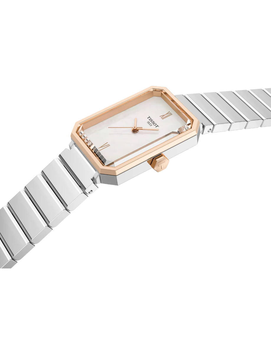 Side view of Tissot wristwatch with stainless steel case and bracelet, and white mother-of-pearl dial.