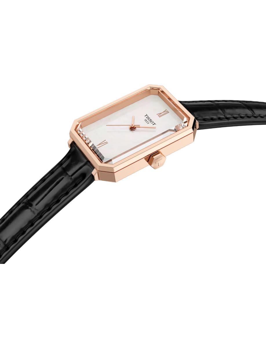 Side view of Tissot wristwatch with stainless steel case, white mother-of-pearl dial, and black alligator-style grained cowhide leather.