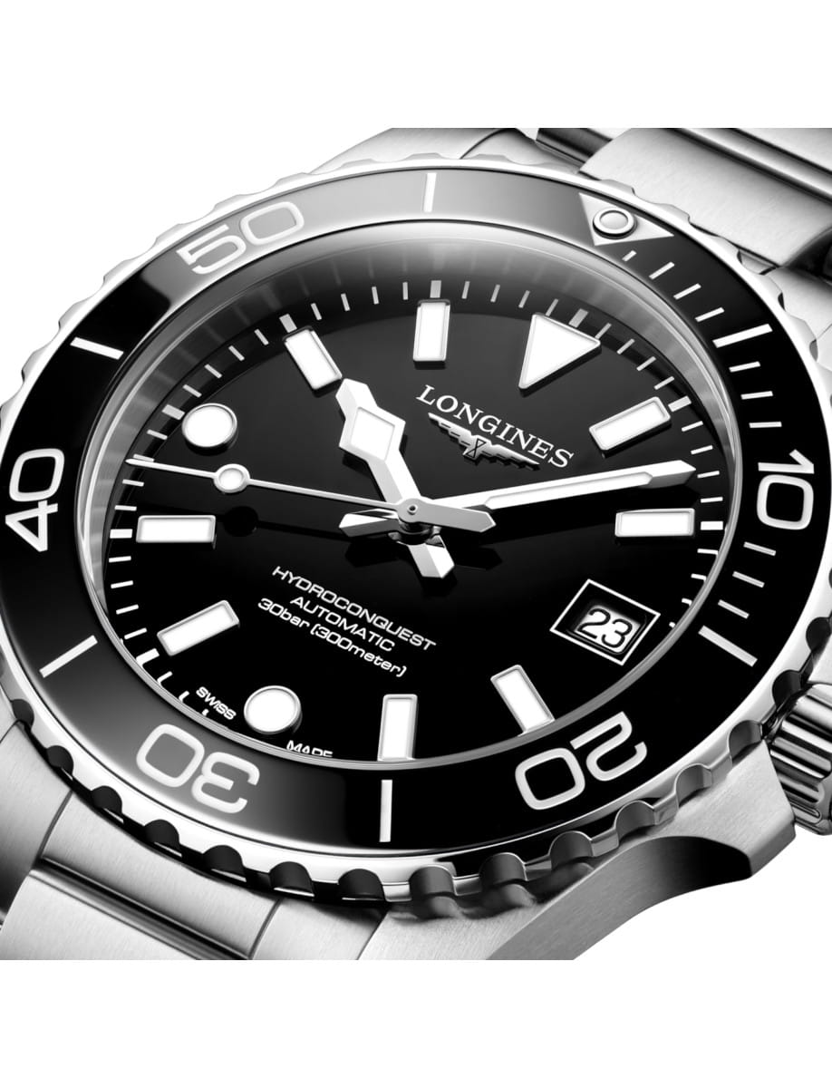 Side view of Longines Hydroconquest wristwatch with stainless steel case and bracelet, and black dial.