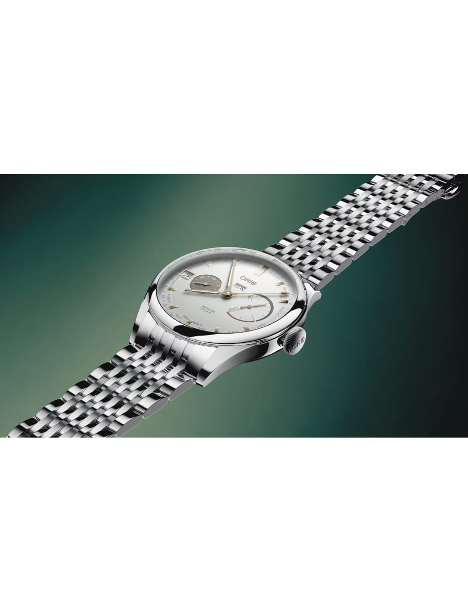 Side view of Oris Artelier Calibre 113 wristwatch with stainless steel case and bracelet, and white dial.