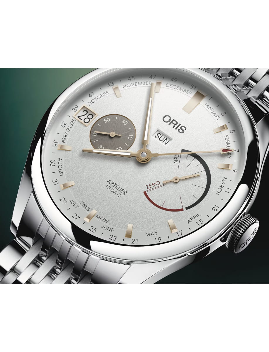 Close view of Oris Artelier Calibre 113 wristwatch with stainless steel case and bracelet, and white dial.