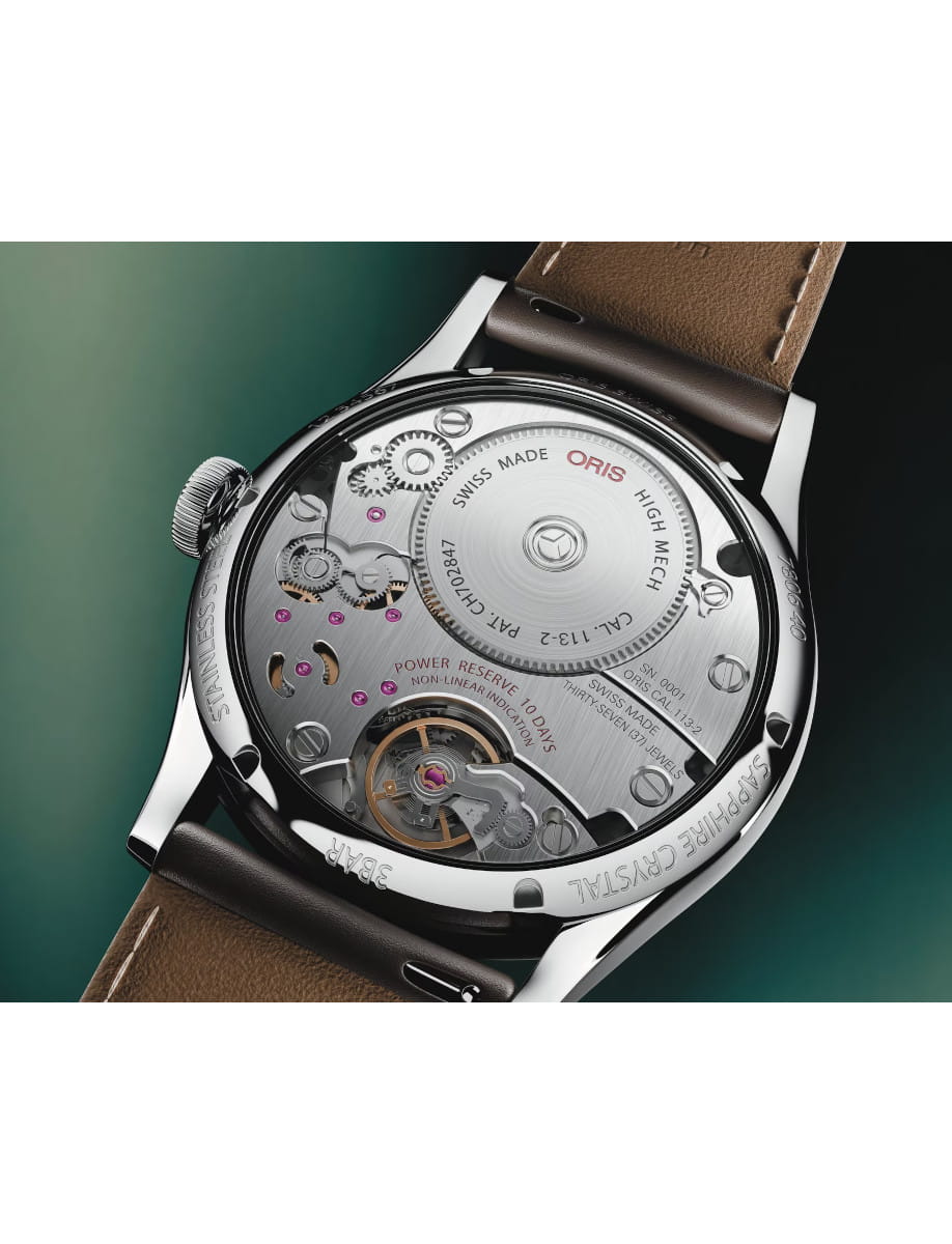 Back view of Oris Artelier Calibre 113 wristwatch with stainless steel case, open caseback, and dark brown cordovan strap.