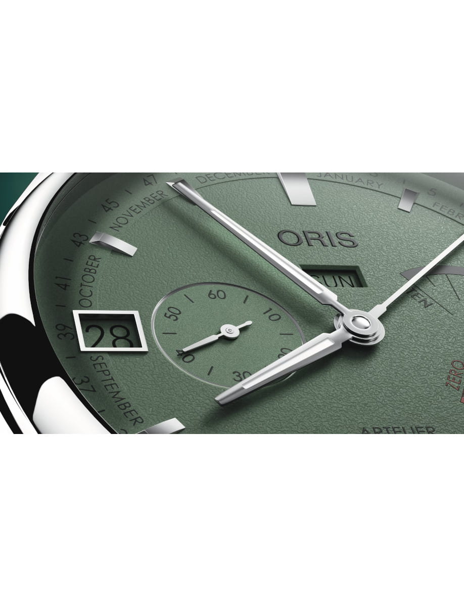 Close view of Oris Artelier Calibre 113 wristwatch with stainless steel case, green dial, and dark brown cordovan strap.