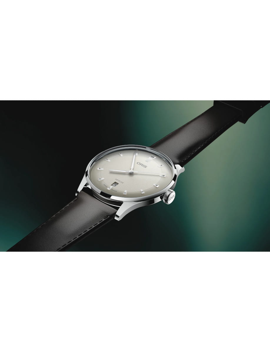 Side view of Oris Artelier Date wristwatch with stainless steel case, white dial, and dark brown leather strap.