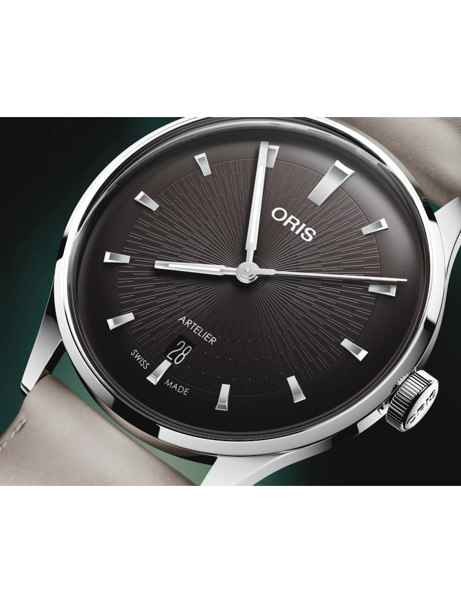 Close view of Oris Artelier Date wristwatch with stainless steel case, chocolate black dial, and dark brown leather strap.