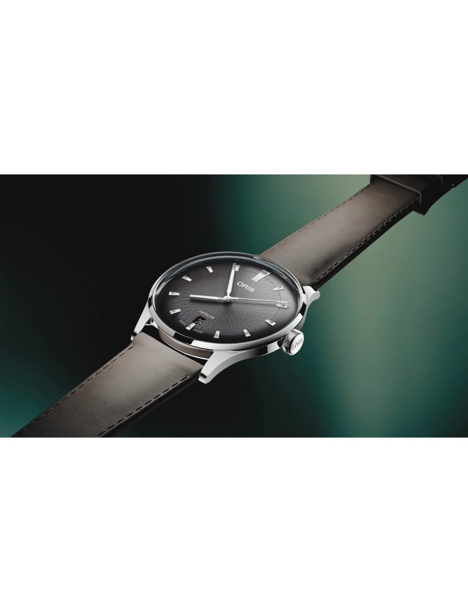 Side view of Oris Artelier Date wristwatch with stainless steel case, chocolate black dial, and dark brown leather strap.