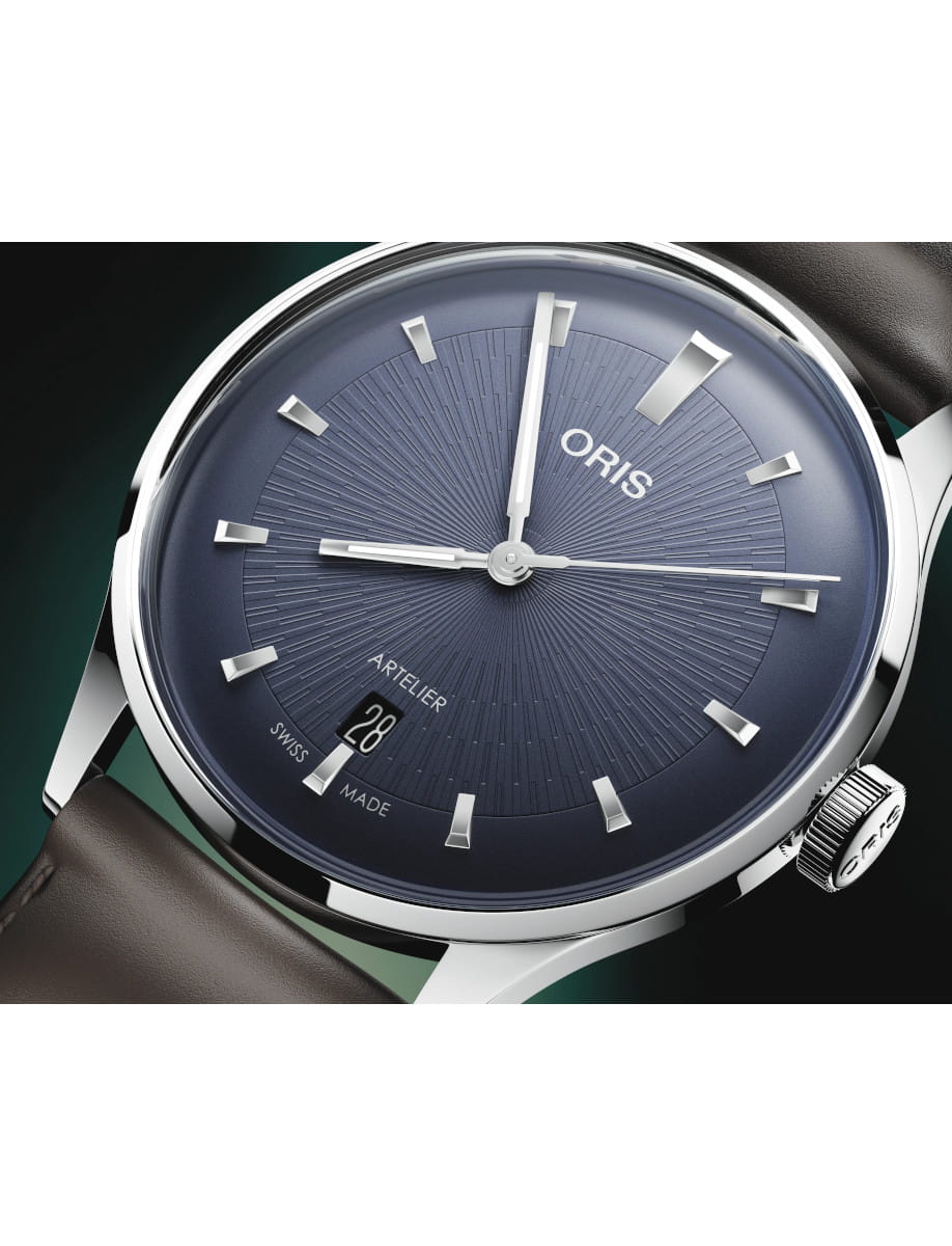 Close view of Oris Artelier Date wristwatch with stainless steel case, dark blue dial, and dark brown leather strap.