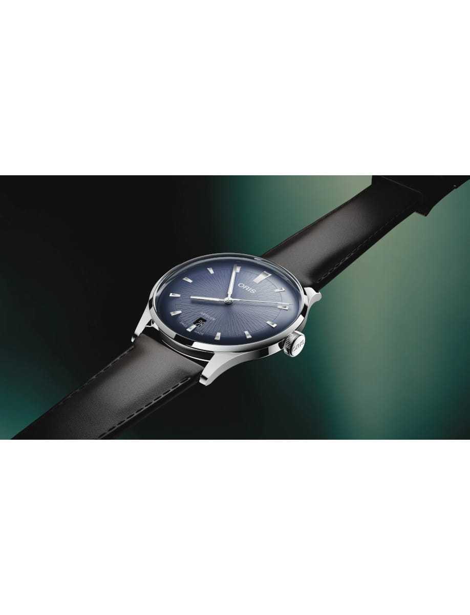 Side view of Oris Artelier Date wristwatch with stainless steel case, dark blue dial, and dark brown leather strap.