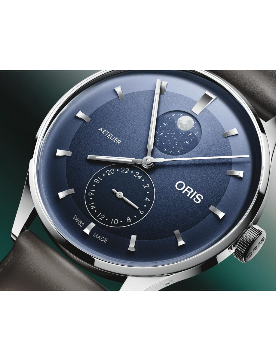 Side view of Oris Artelier wristwatch with stainless steel case, midnight blue dial, and black leather strap.